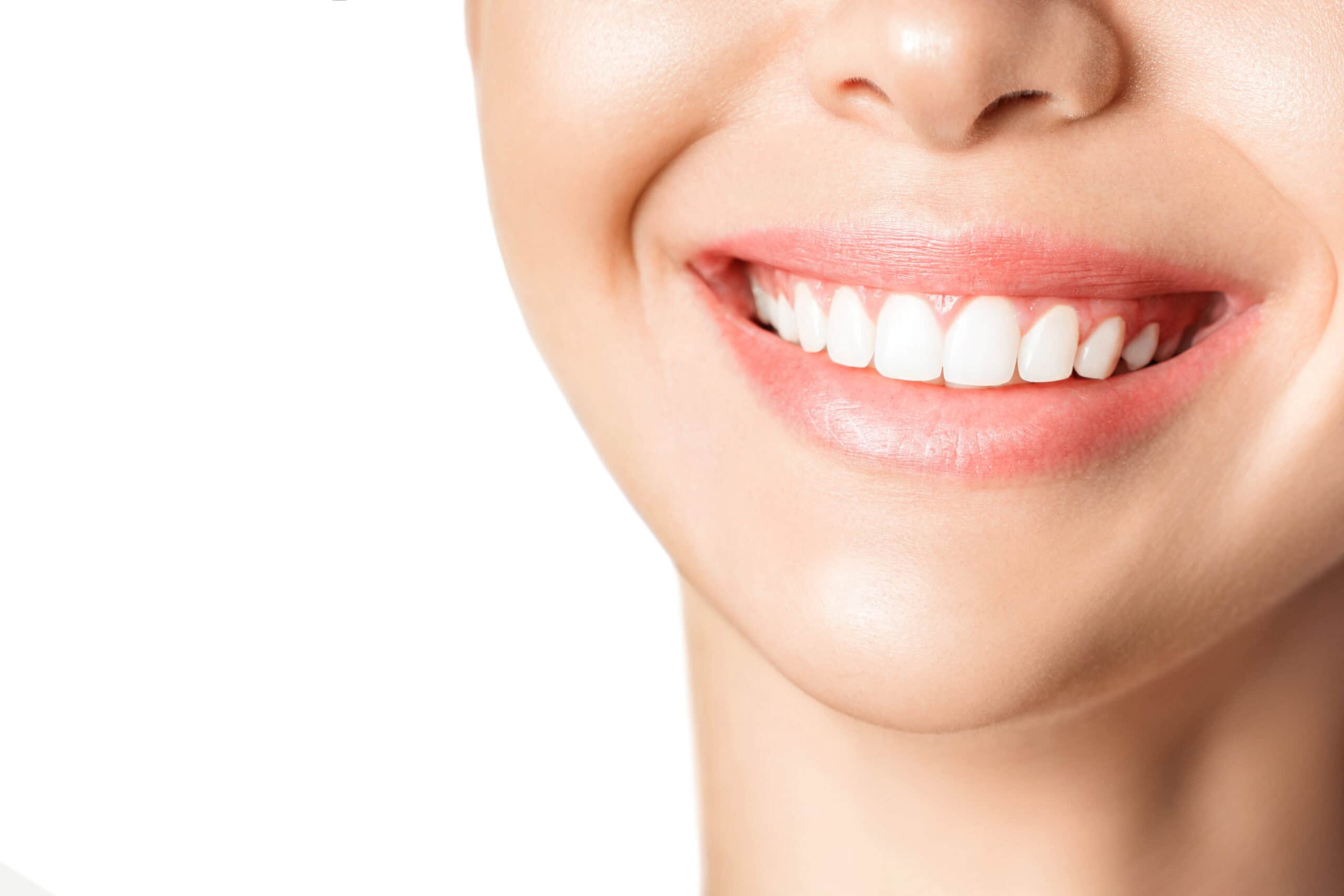 Beautiful young woman with healthy teeth on white background.