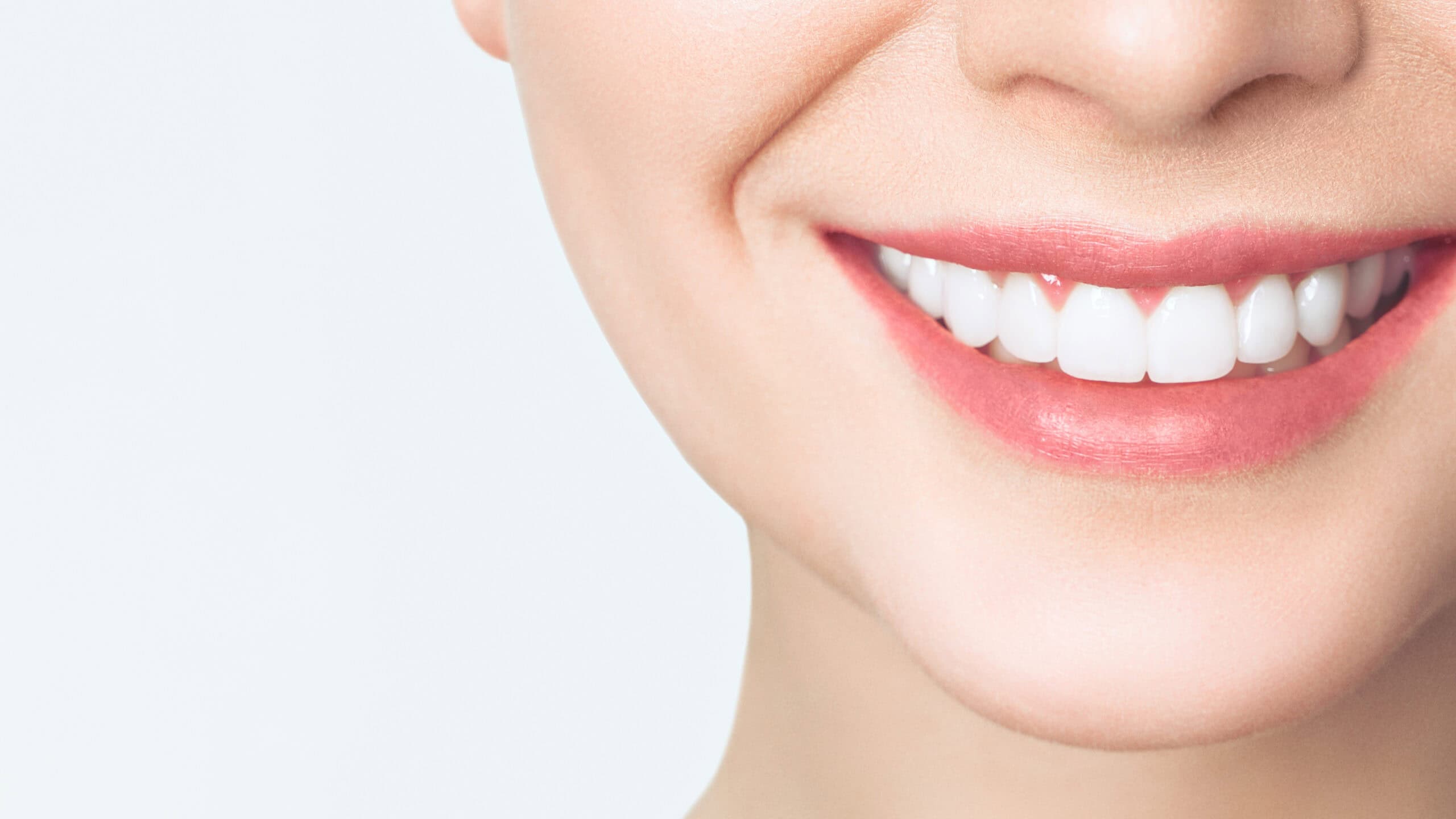 Perfect healthy teeth smile of a young woman. Teeth whitening. Dental clinic patient. Image symbolizes oral care dentistry, stomatology.